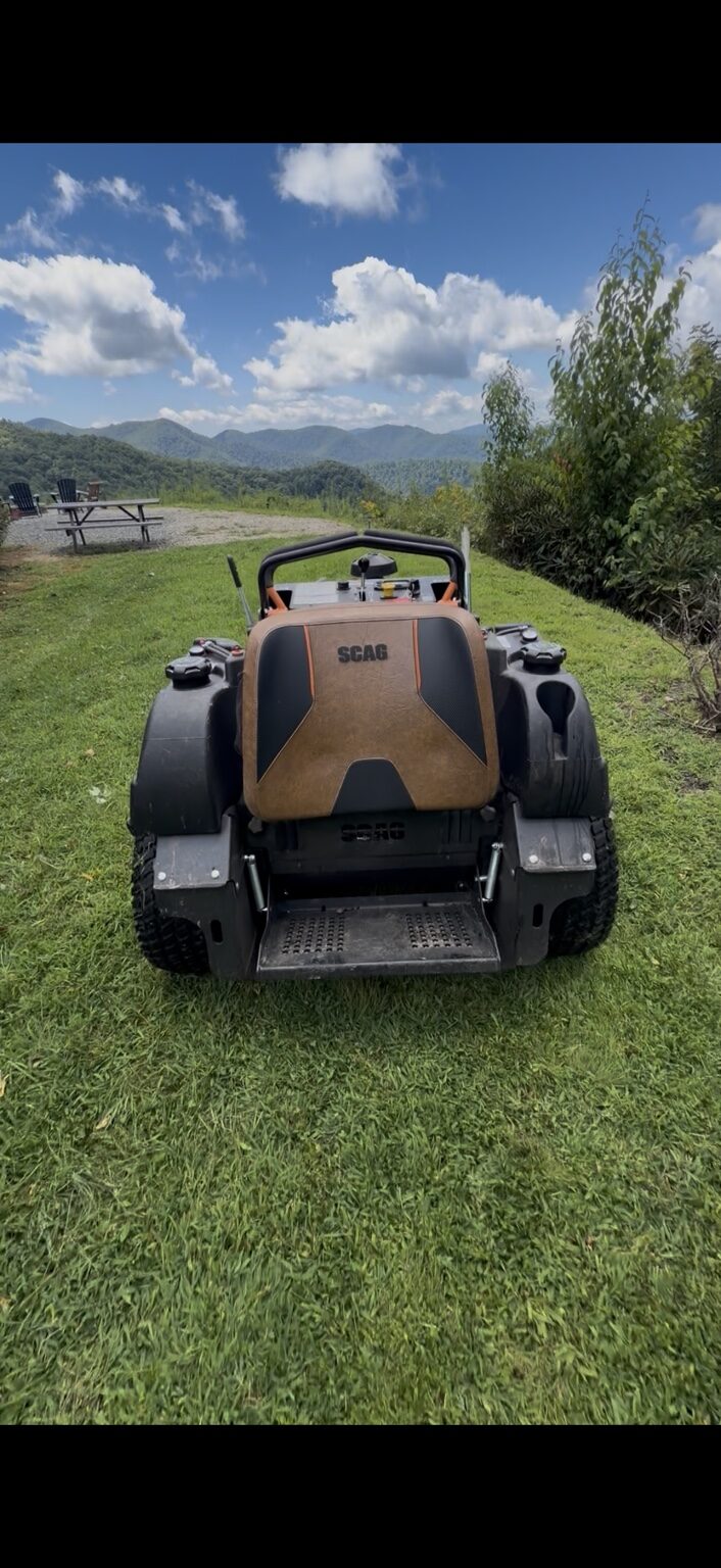 Professional lawn equipment working on a mountain property near Whittier NC